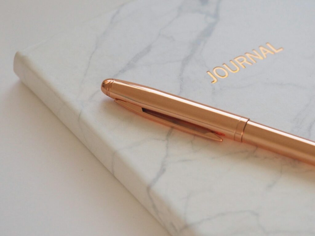 A pen on a gratitude journal