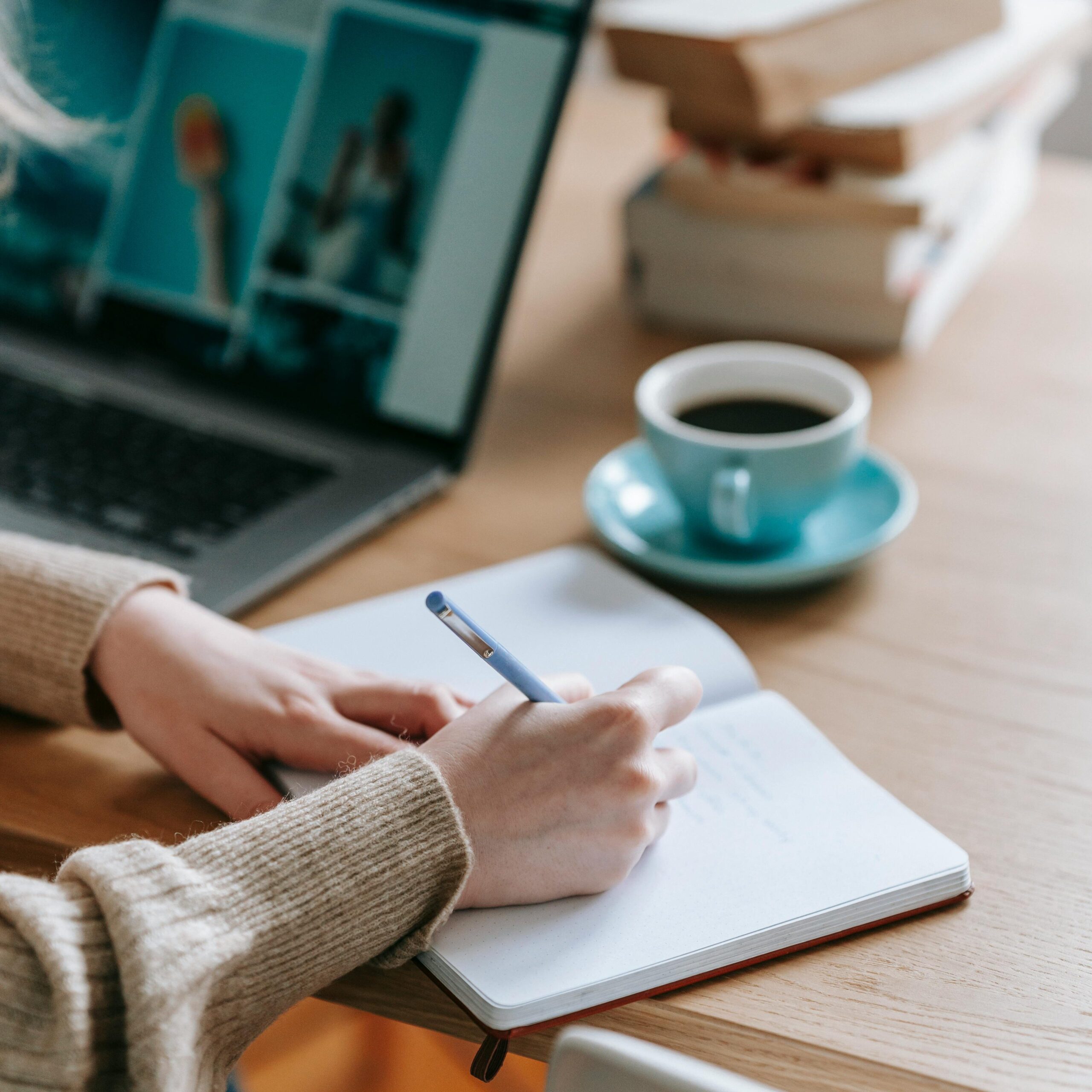 A women writing goals in her notebook for self-improvement